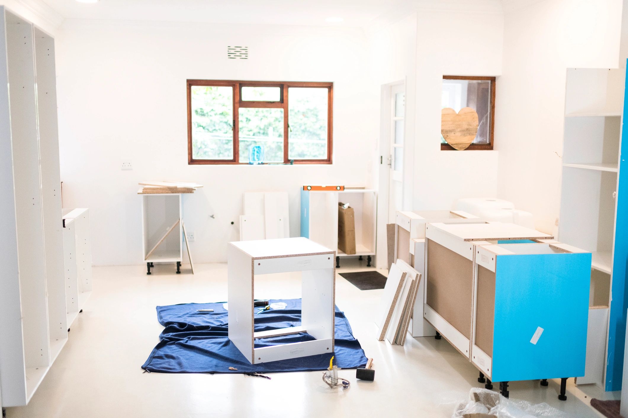 Cabinets being assembled in a home kitchen