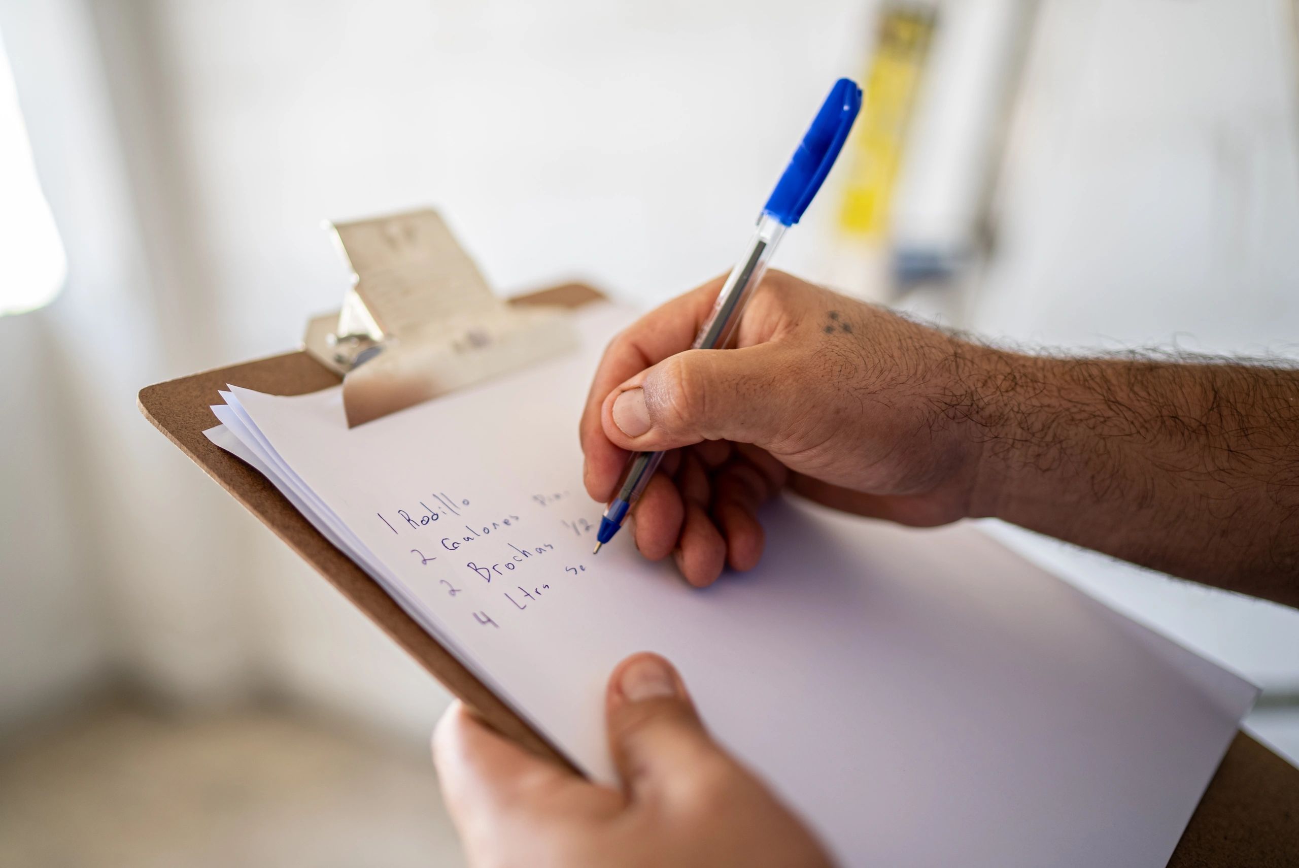 Homeowner reviewing a repair checklist